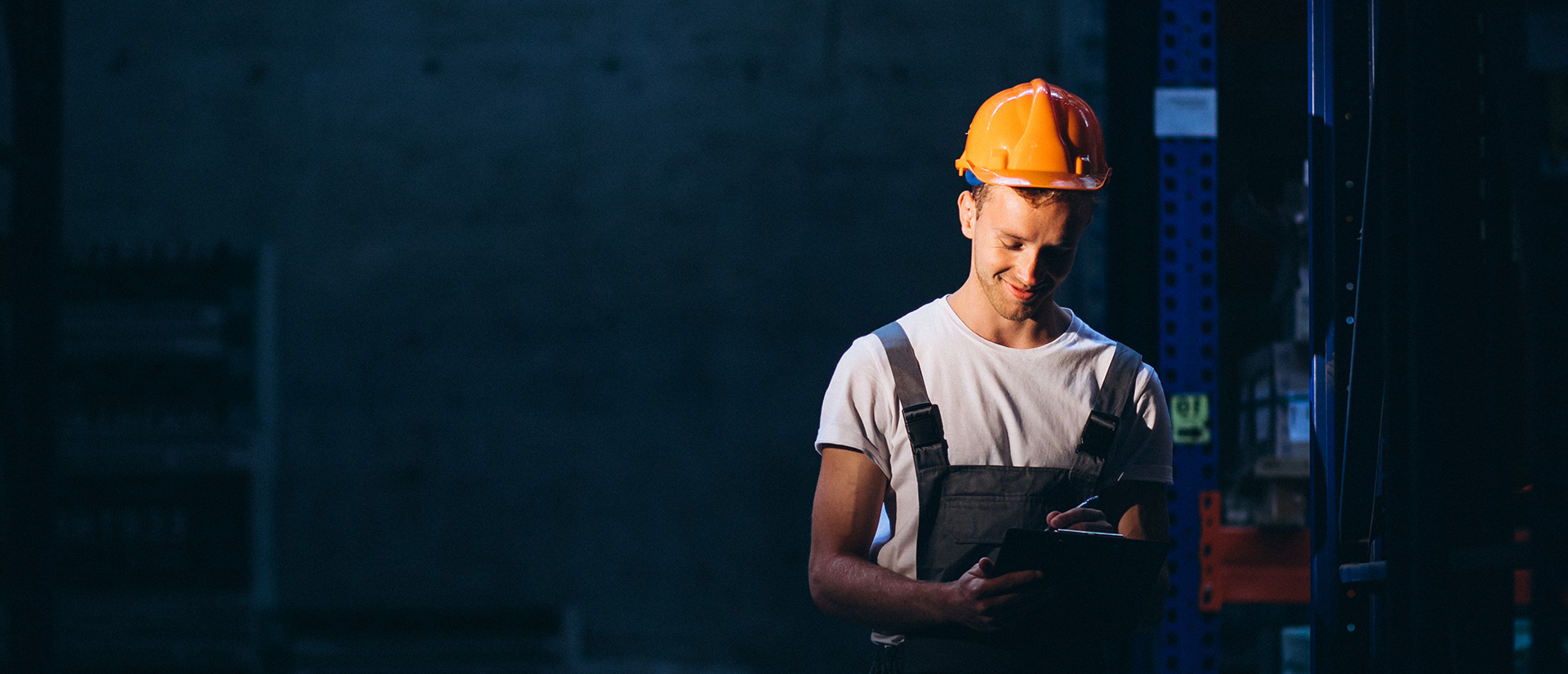 Logistics professional reviewing cargo documentation in a warehouse